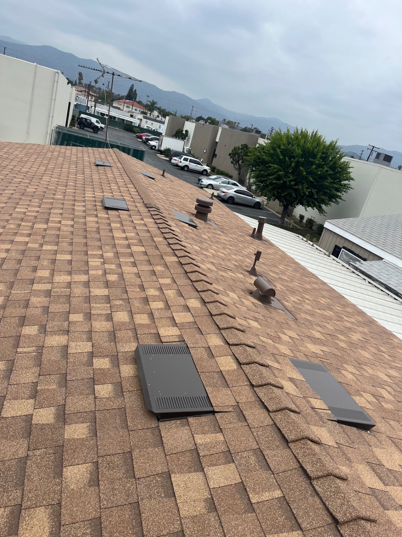 Brown shingle roof overlooking the valley